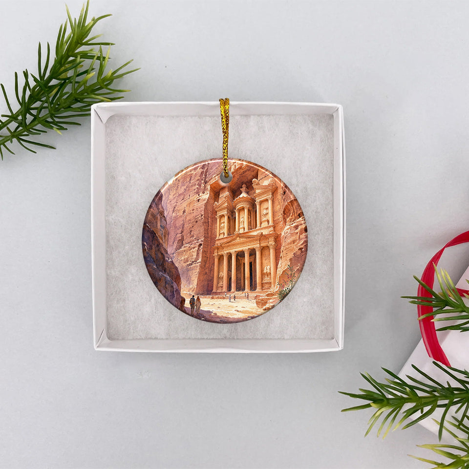 Round ceramic Jordan landmark ornament resting inside an open white gift box ready for holiday gifting.