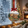 Detailed view of the Spanish landmark ornament hanging in front of a frosty winter window.