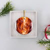 Southwest travel ornament safely packaged inside an open white gift box ready for giving.
