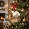 Detailed view of the Italian keepsake hanging from an illuminated holiday tree branch.