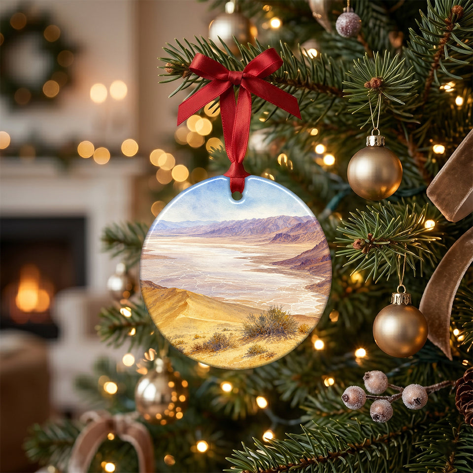 Death Valley travel keepsake hanging from the green branch of an illuminated holiday tree.