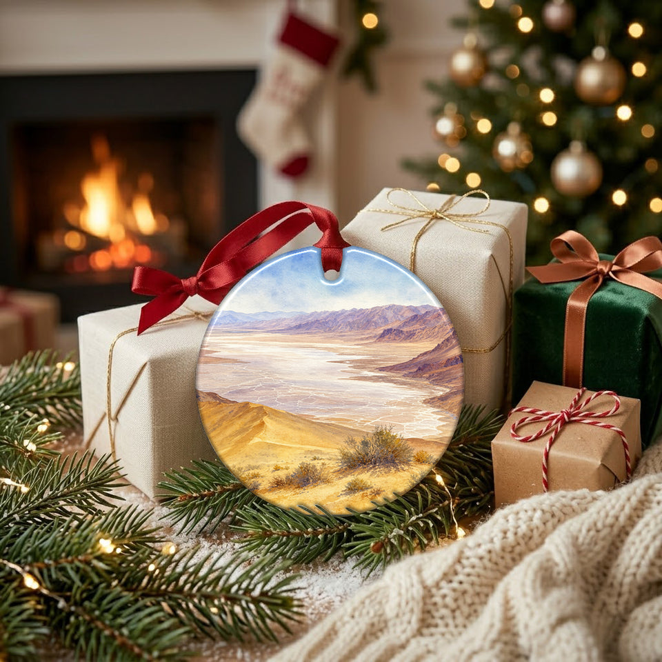 National park souvenir ornament placed beside wrapped holiday gifts near a warm hearth.