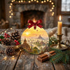 Festive holiday keepsake displayed on a rustic tabletop surrounded by pinecones and candle glow.