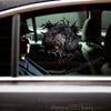 Glossy Black Poodle graphic decal displayed neatly on a white car door exterior.
