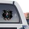 Vibrant Black Poodle decal displayed proudly on the back window of a truck outdoors.