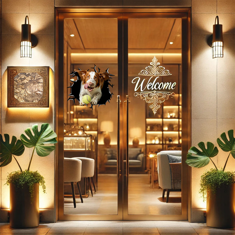 Charming Brittany Spaniel decal mounted smoothly on a glass patio door surface.