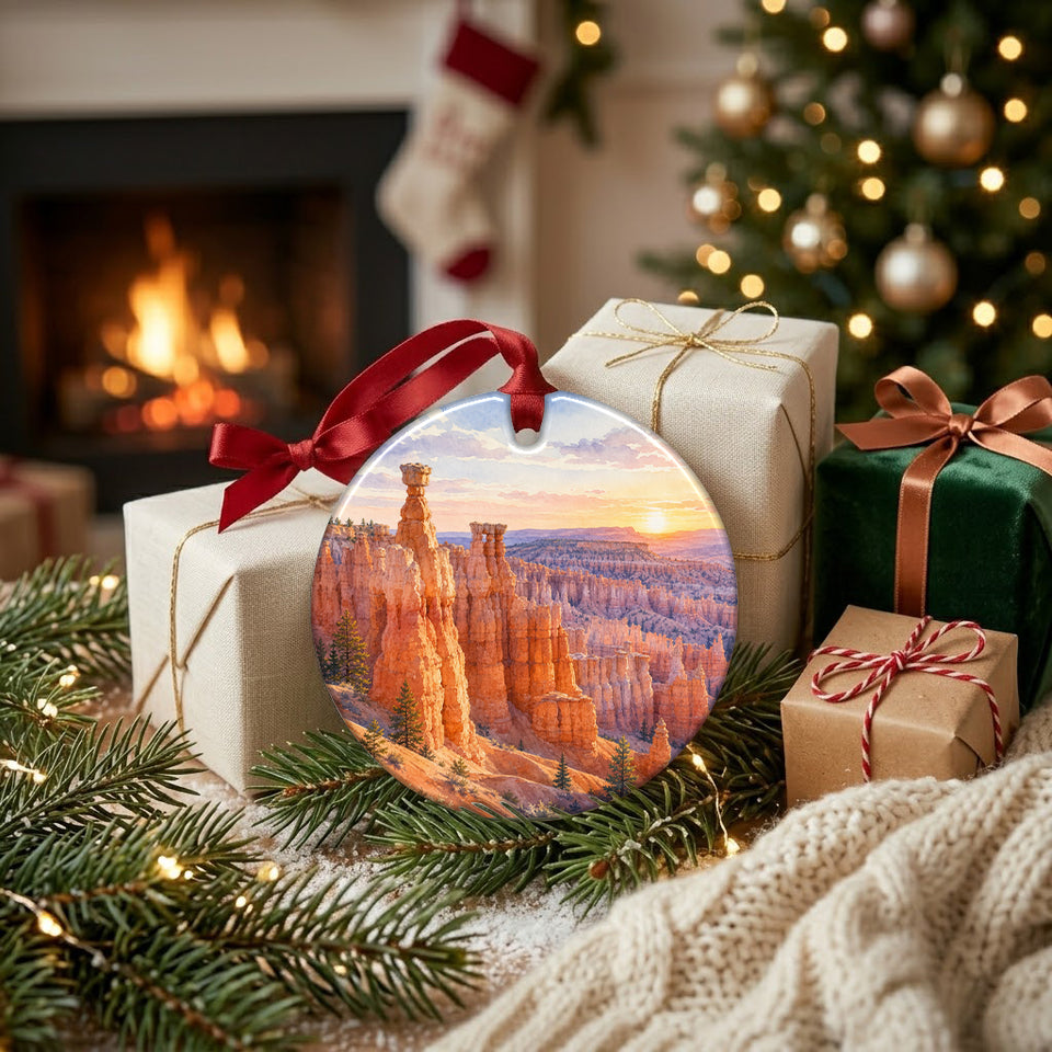 Warm fireplace setting featuring the Bryce Canyon holiday keepsake resting near wrapped gifts