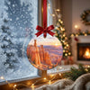 Frosty winter window framing the hanging Bryce Canyon ornament in natural morning daylight