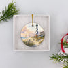 Round Cape Hatteras ornament packaged safely inside an open white gift box ready for gifting.