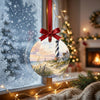 North Carolina lighthouse keepsake hanging in front of a bright, frosty winter window.