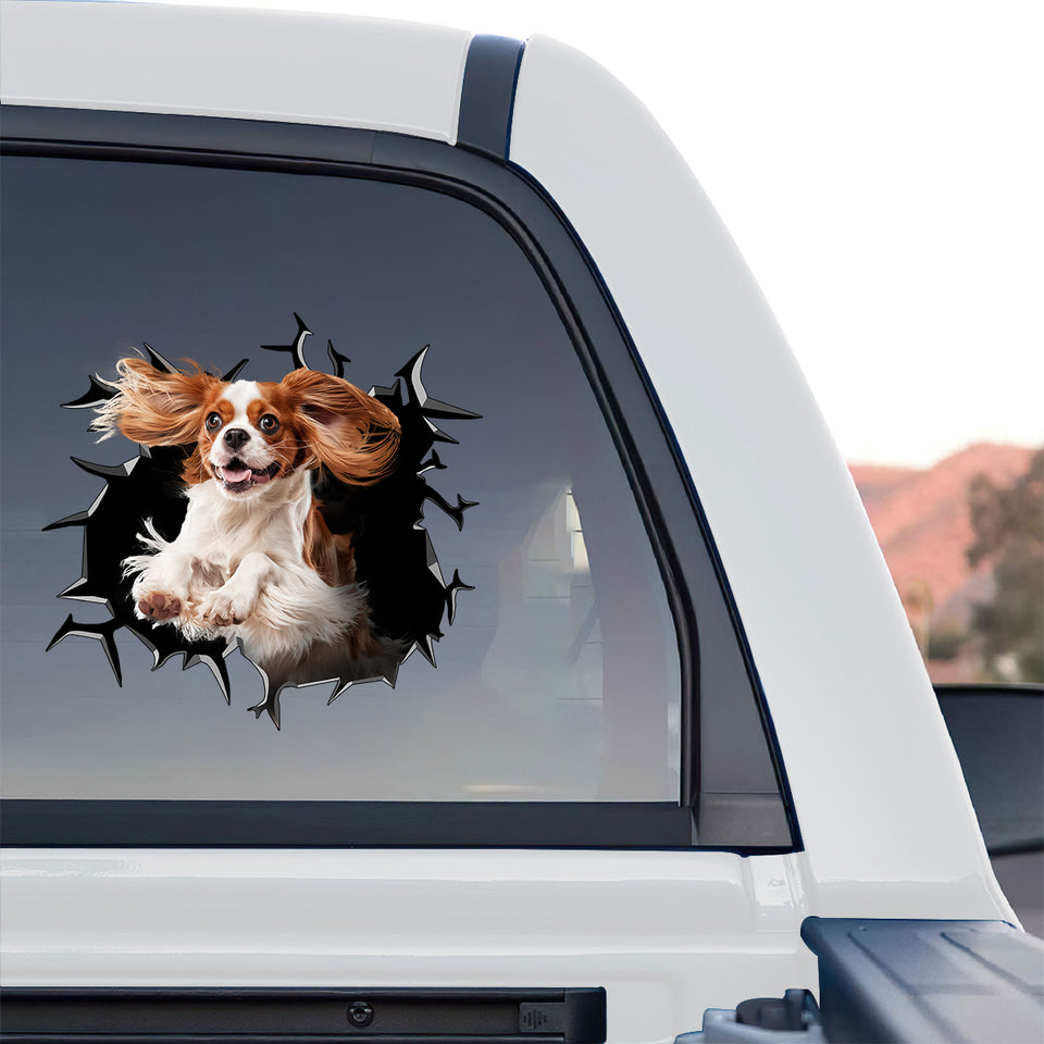Glossy spaniel dog graphic decal displayed on the back glass of a truck.