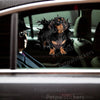 Glossy Dachshund graphic decal applied neatly on a white car door panel.