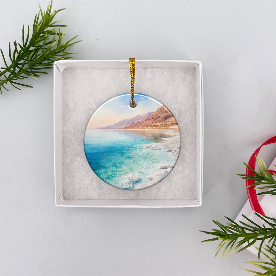 Dead Sea holiday ornament nestled neatly inside an open white gift box ready for gifting.