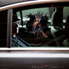 Vibrant Doberman Pinscher graphic sticker applied neatly to a dark car door.