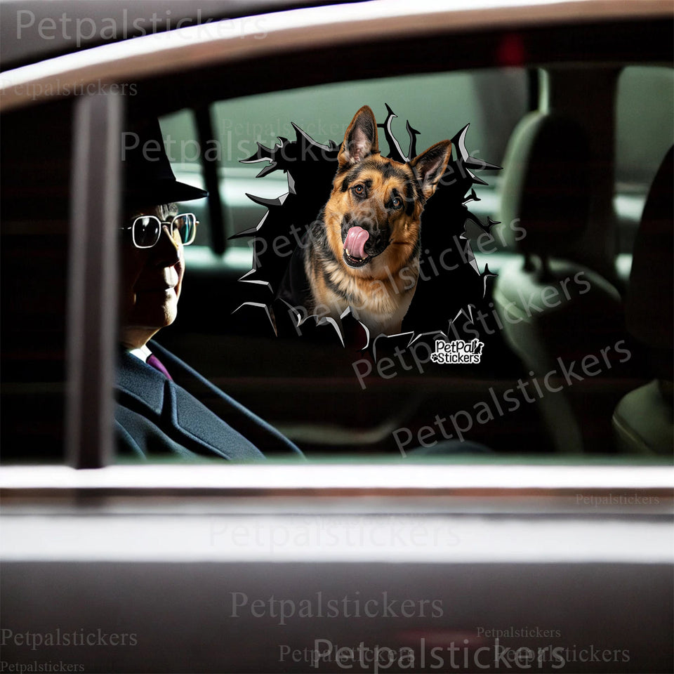 Funny German Shepherd decal displayed on a car door showing detailed cracked window art.