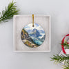 Packaged Montana landscape keepsake resting safely inside an open white gift box.