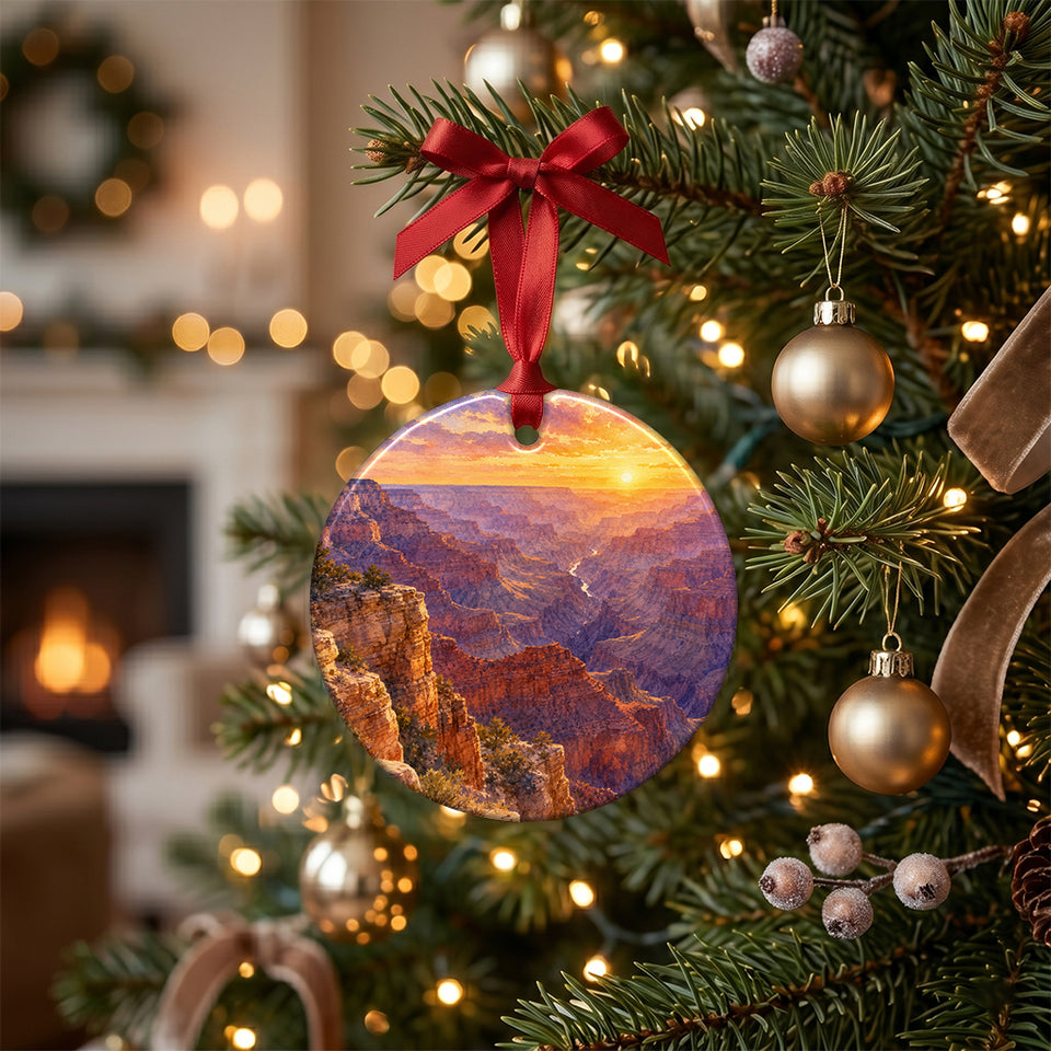 Ceramic canyon vista ornament hanging from an illuminated branch of a decorated holiday tree.