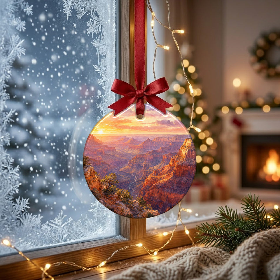 Sunrise canyon art ornament catching natural winter daylight in front of a frosty window.