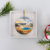 Round ceramic Yellowstone keepsake neatly presented inside an open white gift box ready for gifting.