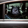 Vibrant feline sticker applied to a car door showcasing realistic fur textures on clean paint.