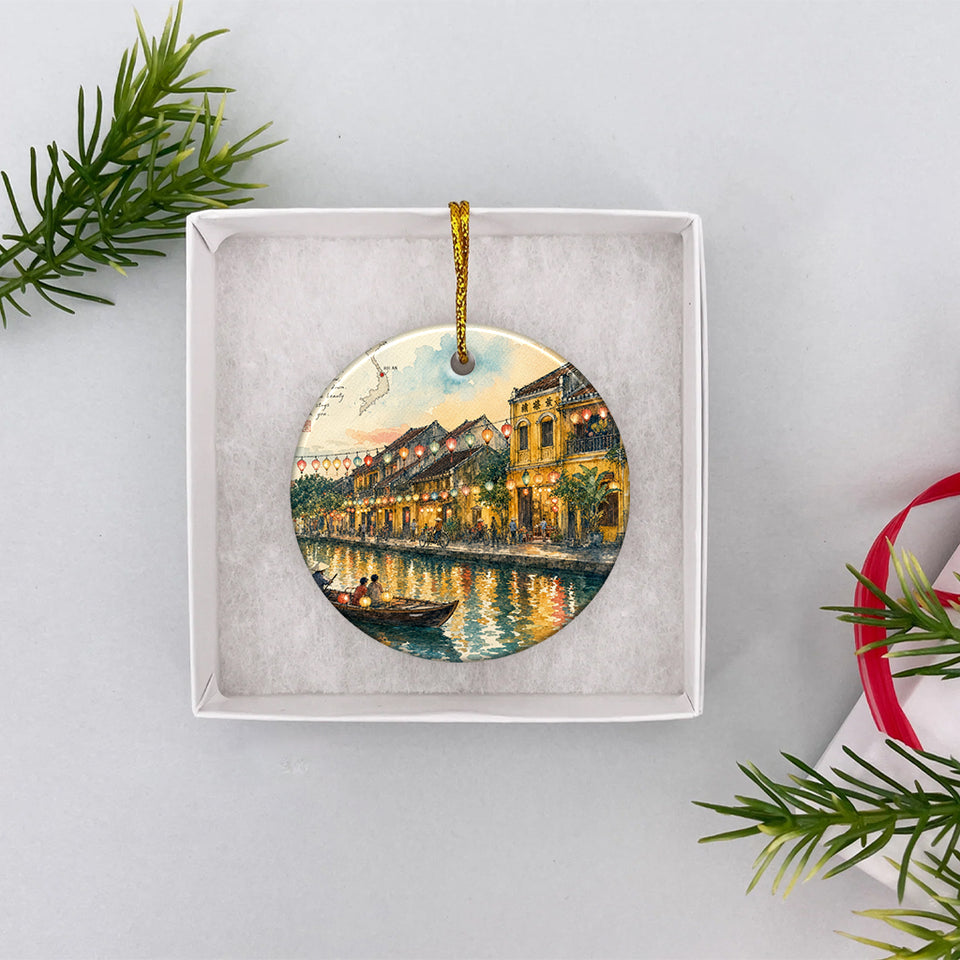 Ceramic holiday ornament nestled inside an open white gift box ready for Christmas giving.