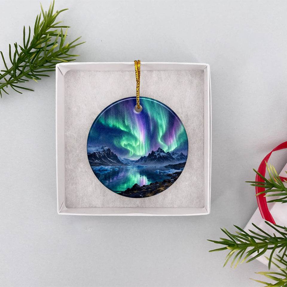Northern lights souvenir ornament displayed inside an opened white gift box ready for holiday giving.