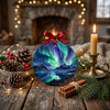 Seasonal centerpiece featuring the Iceland ornament arranged on a rustic tabletop with pinecone accents.