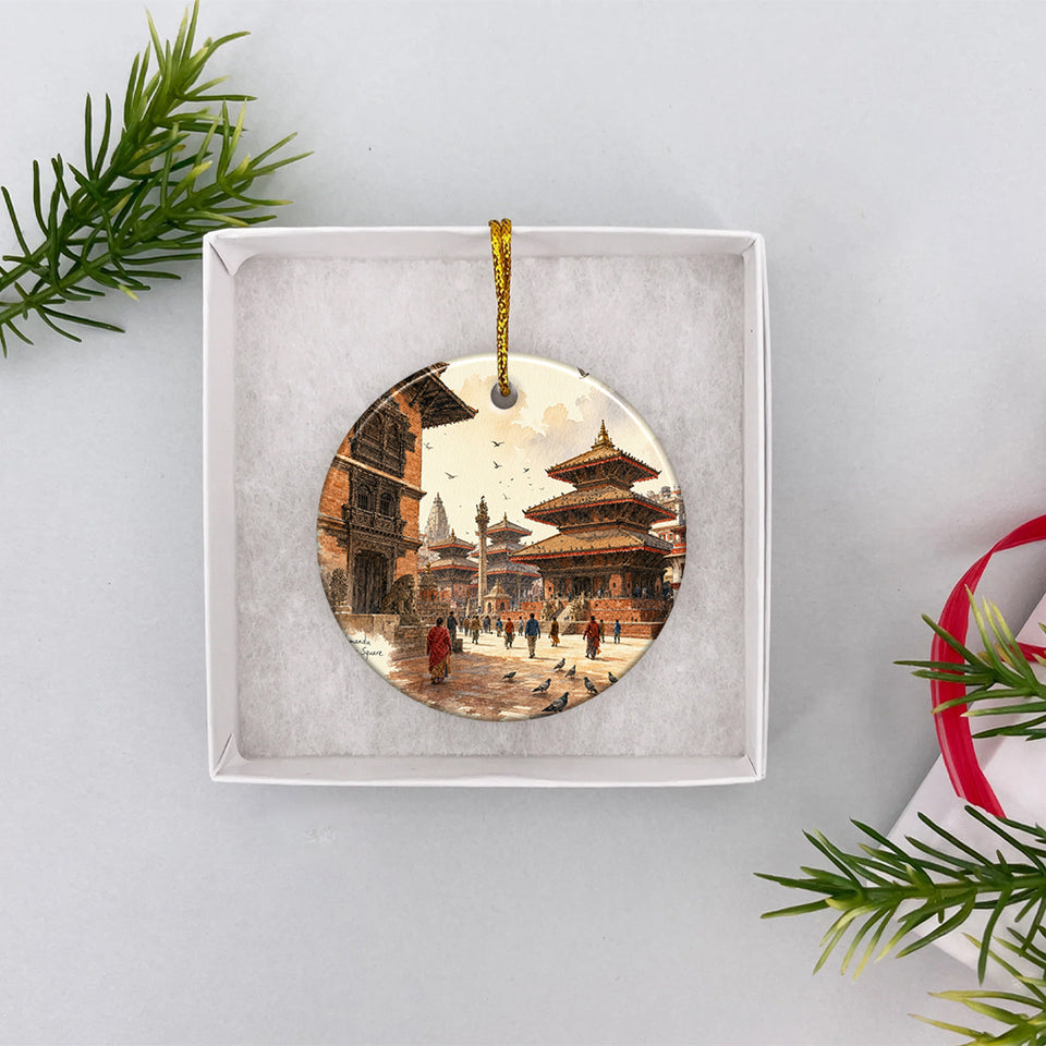 Round ceramic Nepal keepsake resting safely inside an open white gift box ready for gifting.