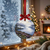 Delicate loch castle ornament hanging by a winter window with soft daylight filtering through.