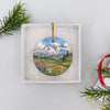 Packaged Mount Rainier holiday keepsake presented neatly inside an open white gift box.