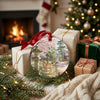Japanese landmark ornament resting beside wrapped holiday gifts near a cozy brick fireplace.
