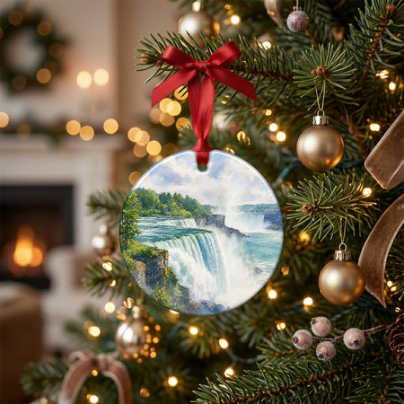 Scenic waterfall ornament resting on a rustic holiday table surrounded by pinecones and gentle candlelight.