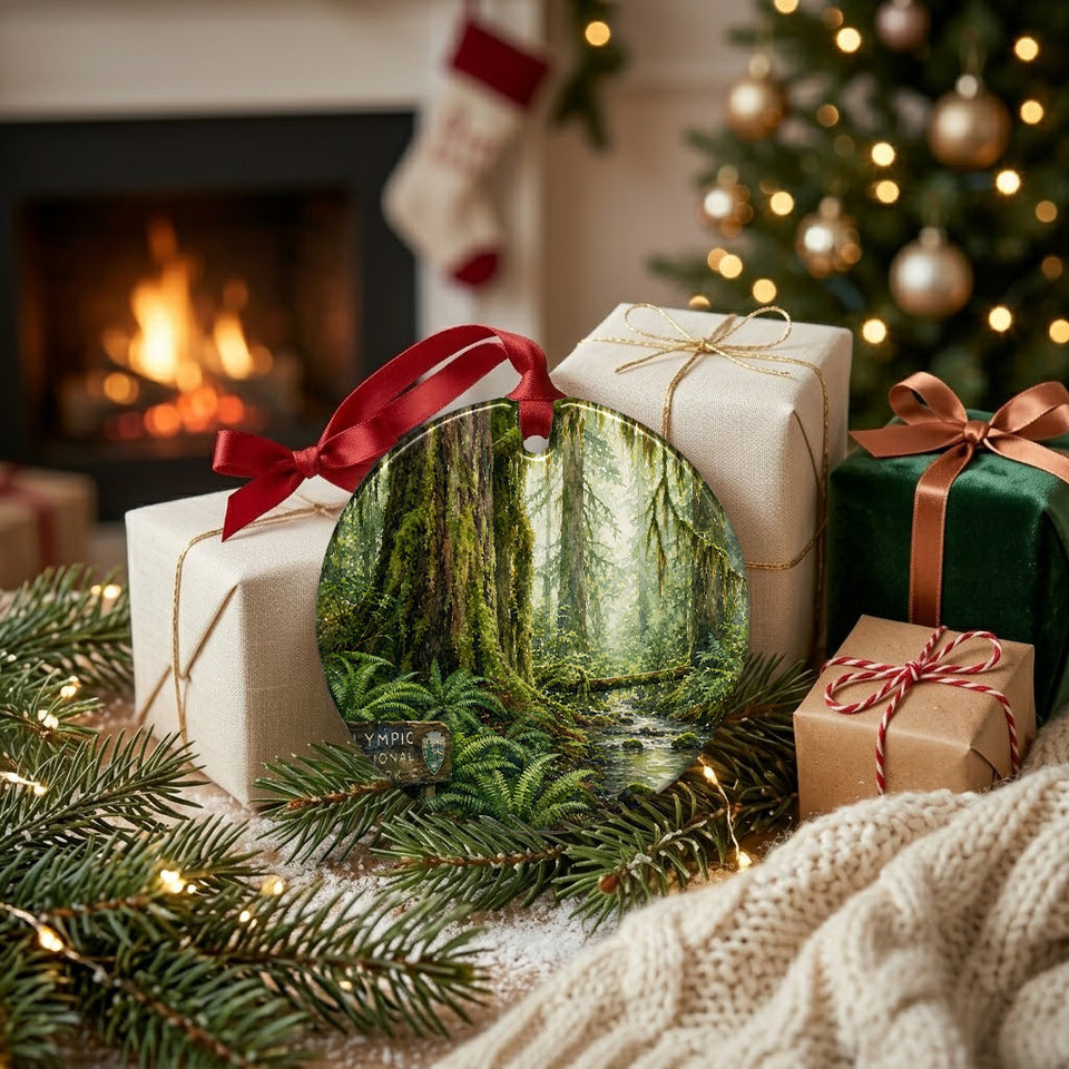 Ceramic rainforest ornament styled beside festive holiday gifts near a glowing living room fireplace.