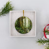 Round Olympic National Park holiday souvenir presented neatly inside an open white gift box.