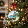 Ceramic Thailand holiday ornament hanging on an illuminated Christmas tree branch.