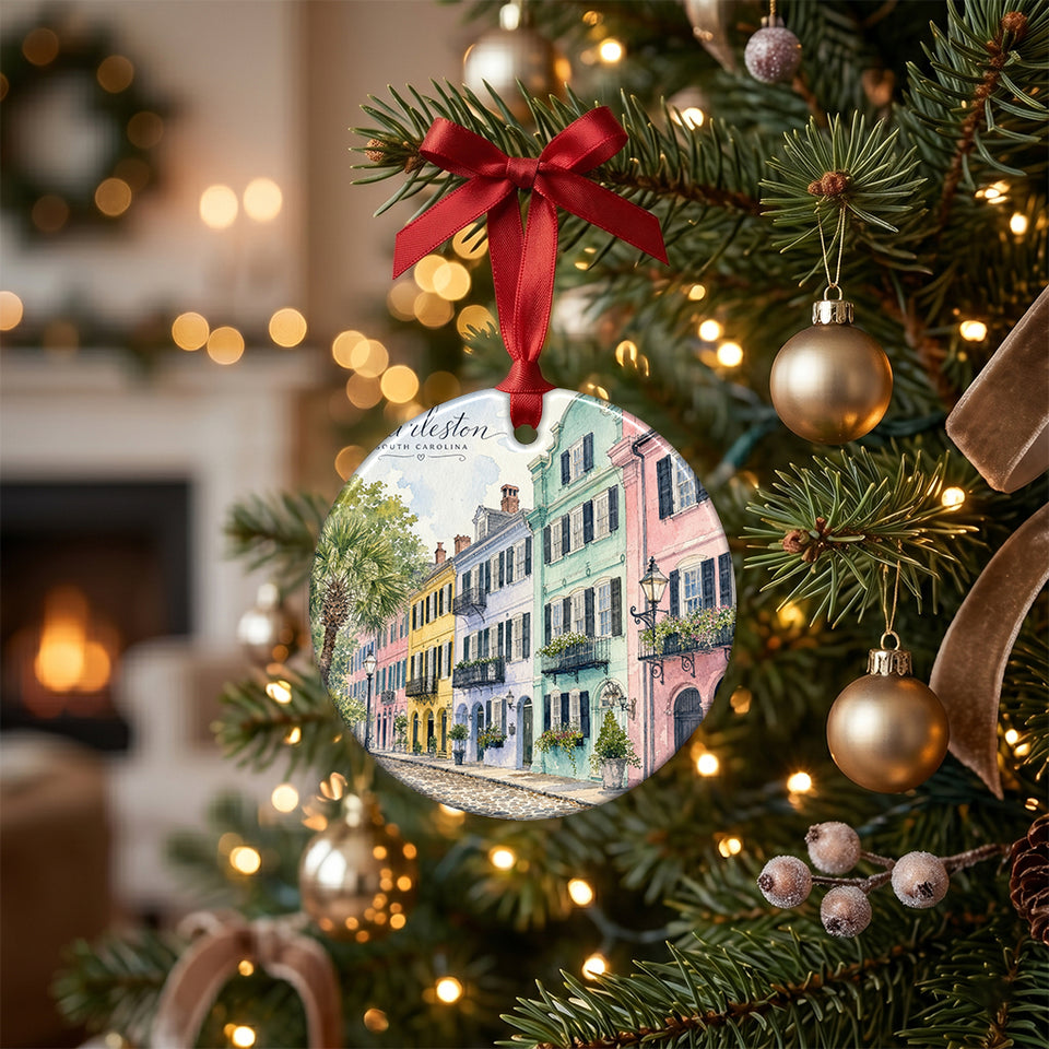 Ceramic Charleston holiday keepsake hanging from the green branch of an illuminated Christmas tree.
