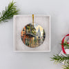 Ceramic travel keepsake neatly packaged inside an opened white gift box ready for holiday gifting