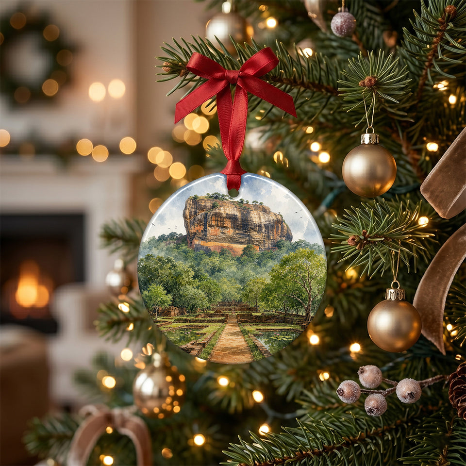 Holiday ornament featuring Sigiriya hanging among glowing lights on an evergreen tree branch.