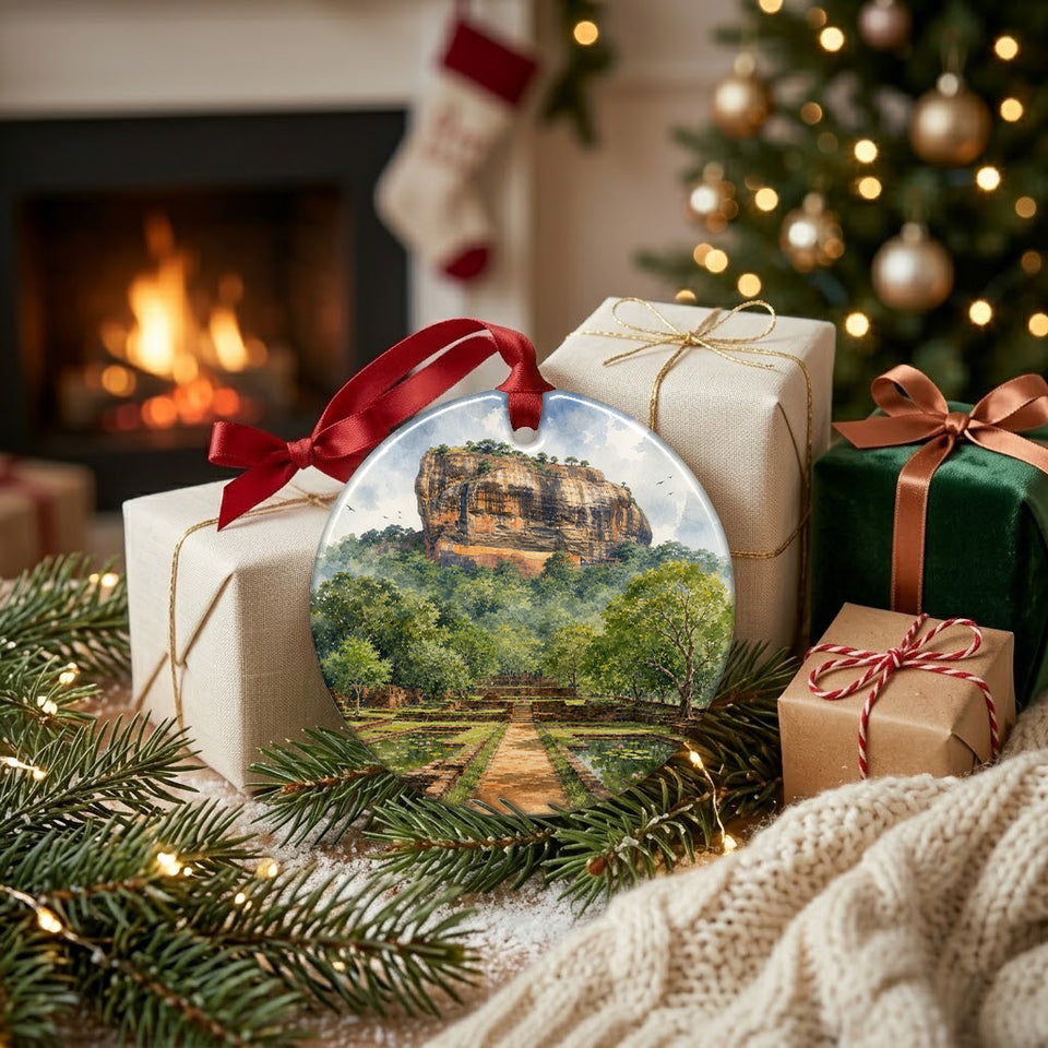Round Sri Lanka keepsake ornament resting next to festive wrapped gifts in front of a warm fireplace.