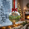 Ceramic holiday decoration with the rock fortress design displayed in a frosty winter window.