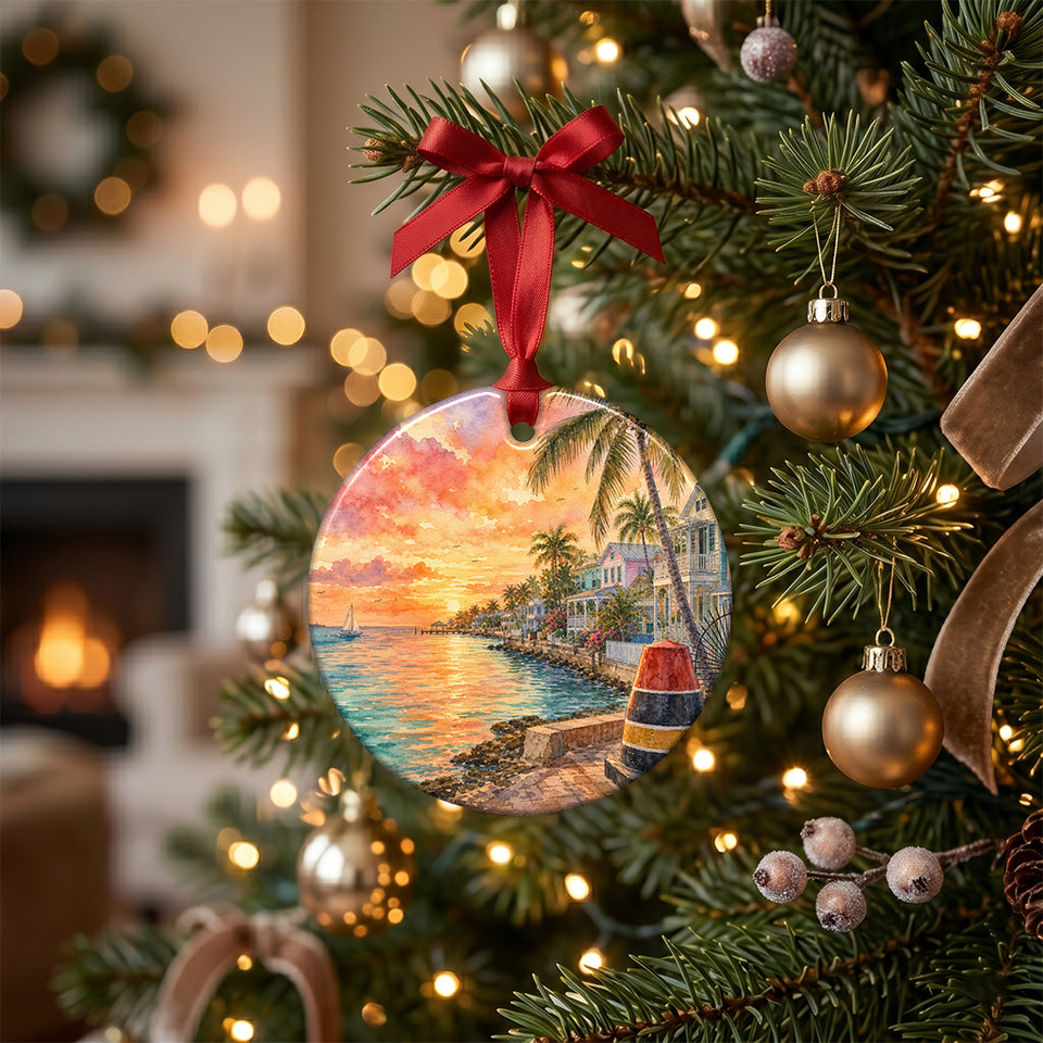 Key West buoy ceramic ornament hanging gracefully on a lit Christmas tree branch surrounded by holiday lights.