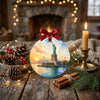 Travel memory ceramic keepsake arranged on a table beside seasonal pinecone accents.