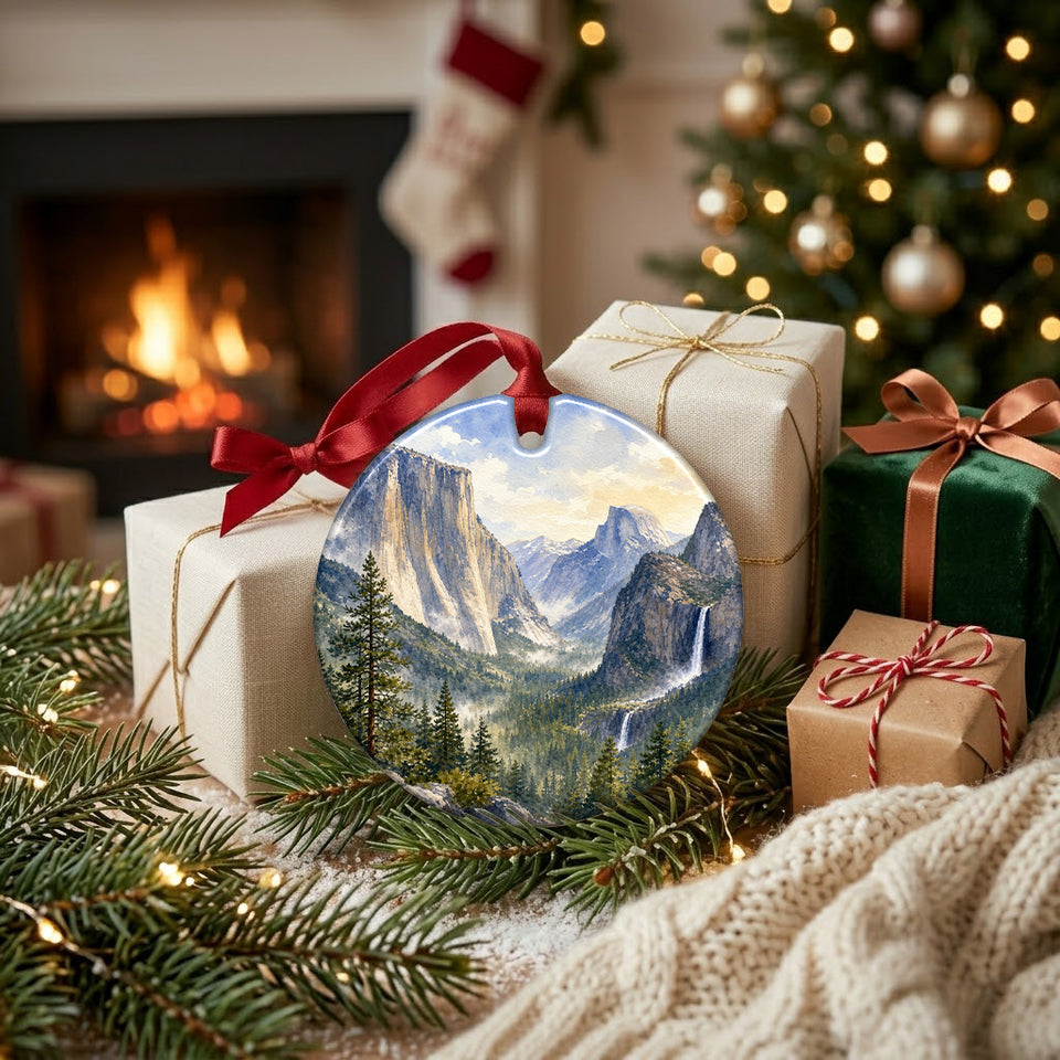 Ceramic national park ornament resting near wrapped gifts and a warm glowing hearth.